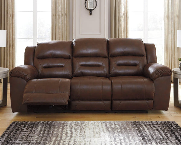 Stoneland Chocolate Faux Leather Power Reclining Sofa angled side view