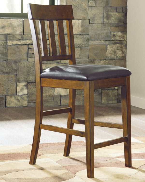 Ralene Medium Brown Upholstered Counter Height Bar Stool front angle