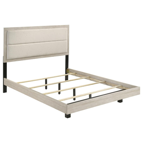 Trenton Eastern King panel bed, front view showing upholstered cream headboard
