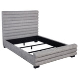 Patricia queen bed upholstered in grey boucle fabric with tall channel-tufted headboard