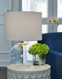 Samder table lamp with clear glass base and brass finish front view