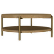 Arini round coffee table with sand wash finish and woven rattan storage shelf, front angle