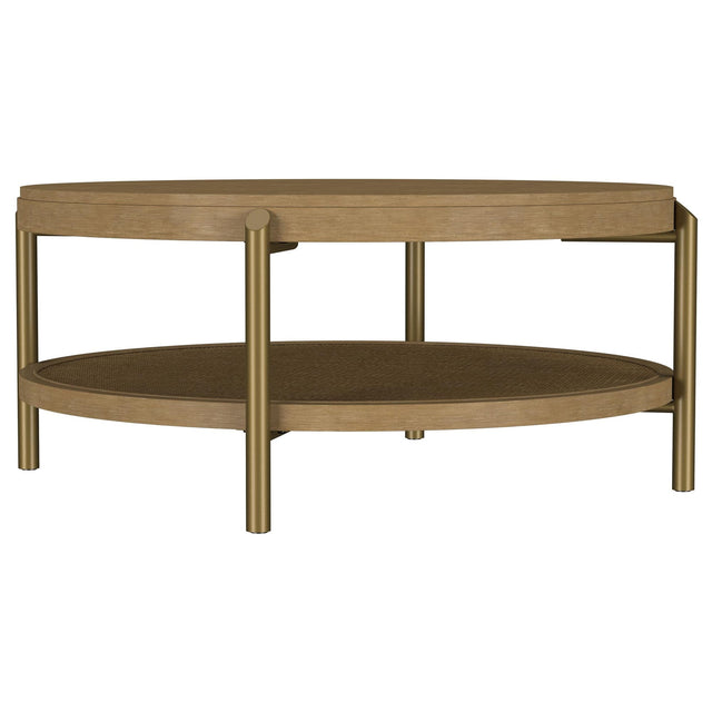 Arini round coffee table with sand wash finish and woven rattan storage shelf, front angle