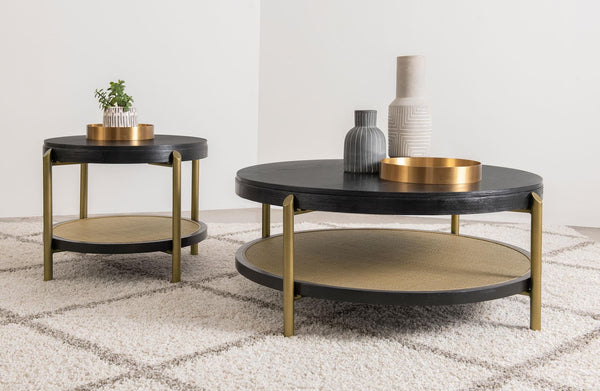 Arini round coffee table with black finish and woven rattan lower shelf, front view
