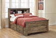 Trinell Full Brown Bookcase Bed with 2 storage drawers in a bedroom setting