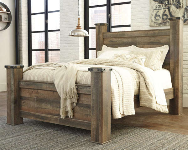 Front view of Trinell Brown Queen Poster Bed with rustic plank finish