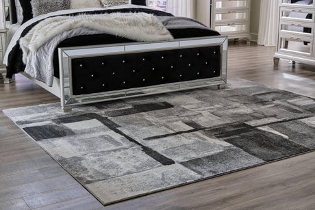 Brycebourne medium rug in black, cream, and gray abstract pattern - top view