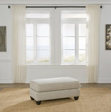 Asanti Fog Chenille Ottoman angled view showing tufted cushion and grey chenille fabric