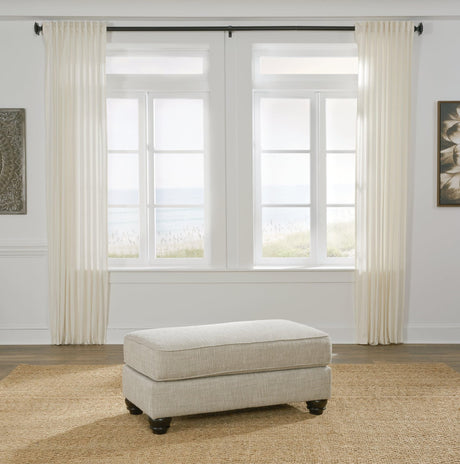 Asanti Fog Chenille Ottoman angled view showing tufted cushion and grey chenille fabric