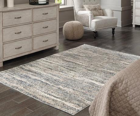 Gizela rug showing ivory, beige, and gray stripes with plush texture