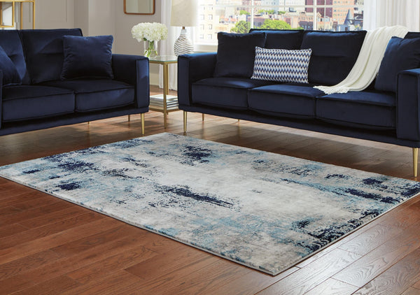 Leonelle 7'10" x 10' white, blue, and gray abstract rectangular rug laid flat