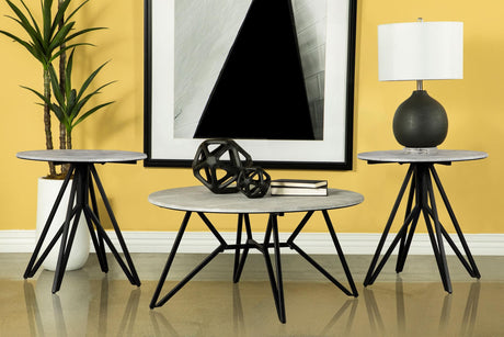 Hadi 3-piece round coffee and end table set, front angle showing cement top and gunmetal geometric base