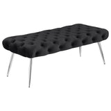 Ella black upholstered tufted bench with stainless steel legs, front view