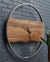 Panchali round wall clock with brown wood and silver metal frame front view