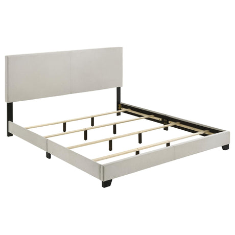 Dorian cream fabric upholstered eastern king panel bed front view