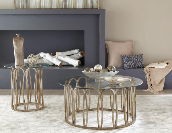 Monett coffee table with round clear tempered glass top and chocolate chrome geometric metal base