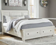Robbinsdale Antique White King Sleigh Bed with Storage - angled side view
