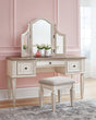 Realyn Two-Tone Vanity with mirror and matching upholstered stool - front view