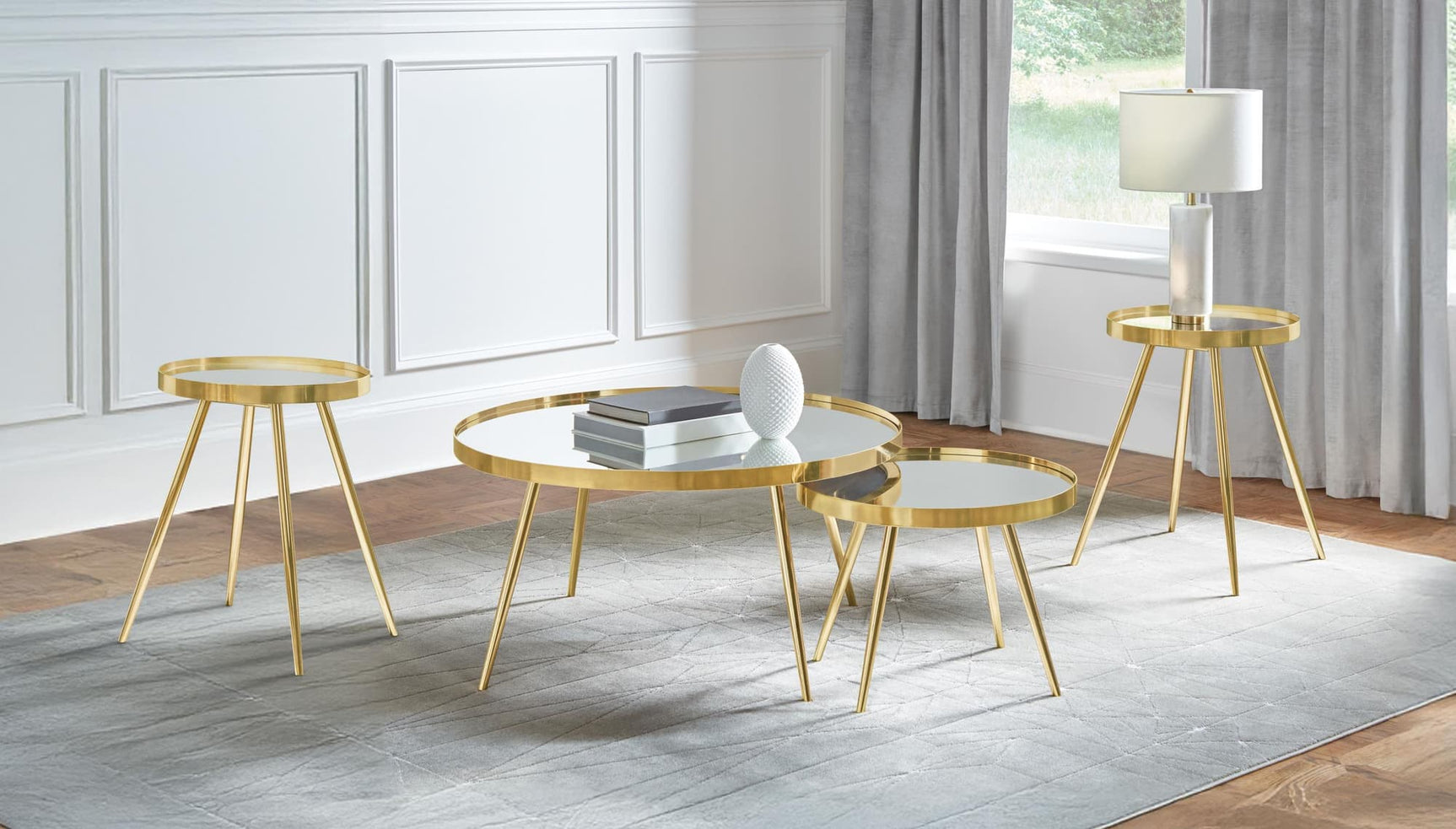 Kaelyn 4-piece round coffee table set with gold metal frame and mirrored tops front view