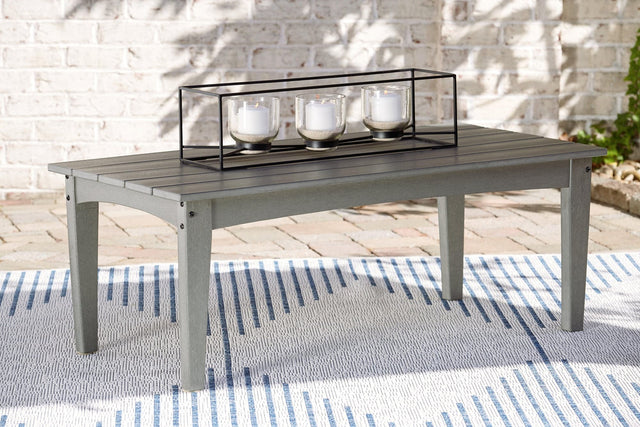 Visola Gray Outdoor Coffee Table angled view showing slatted tabletop and lower shelf