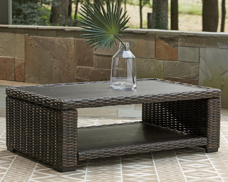 Grasson Lane Brown Coffee Table front angle with resin wicker and aluminum frame