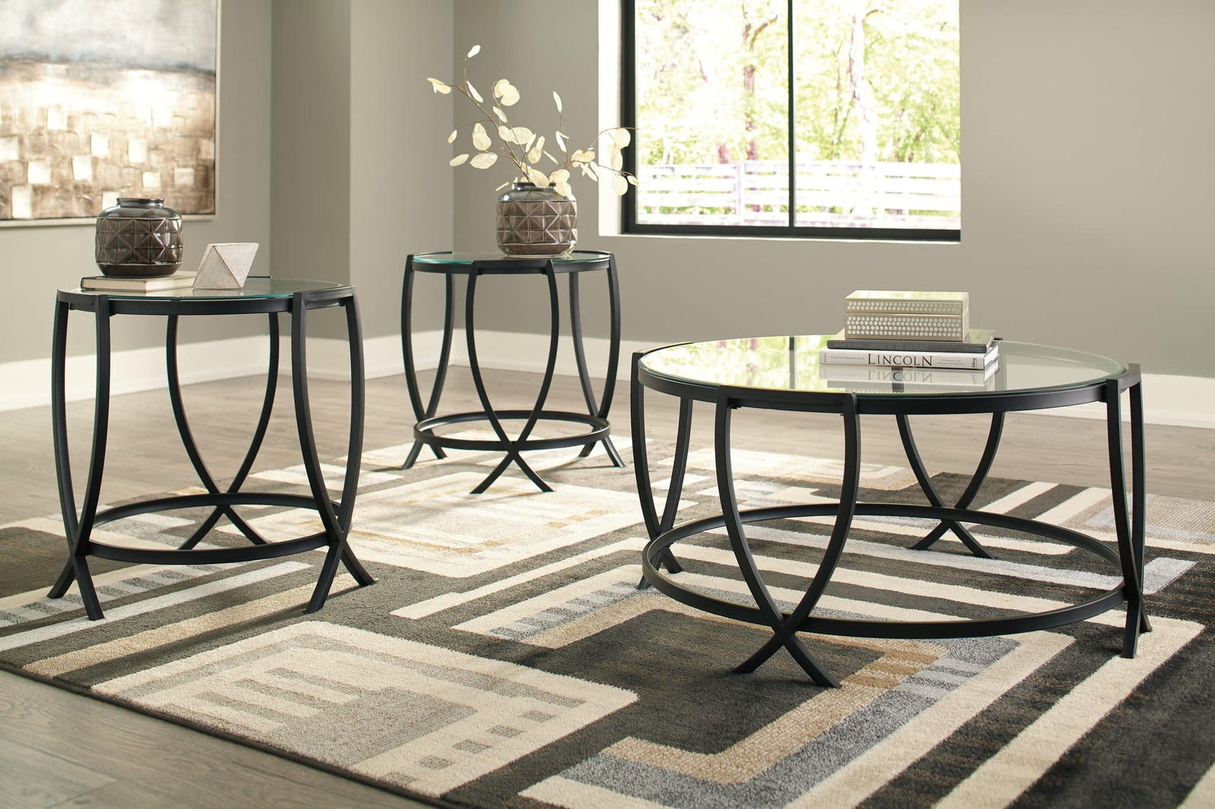 Tarrin Black coffee table with glass top and black metal base