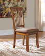 Berringer Rustic Brown Upholstered Dining Chair angled side view