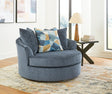 Maxon Place Navy Oversized Swivel Accent Chair angled view