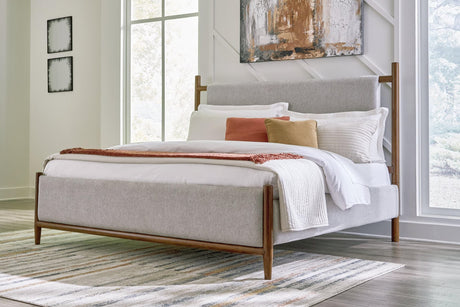 Lyncott king upholstered bed front view showcasing brown polyester headboard