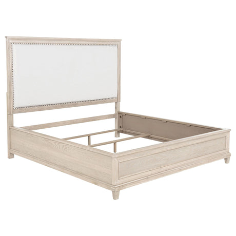 Pembroke Eastern King Panel Bed front view with washed oak frame and cream fabric headboard