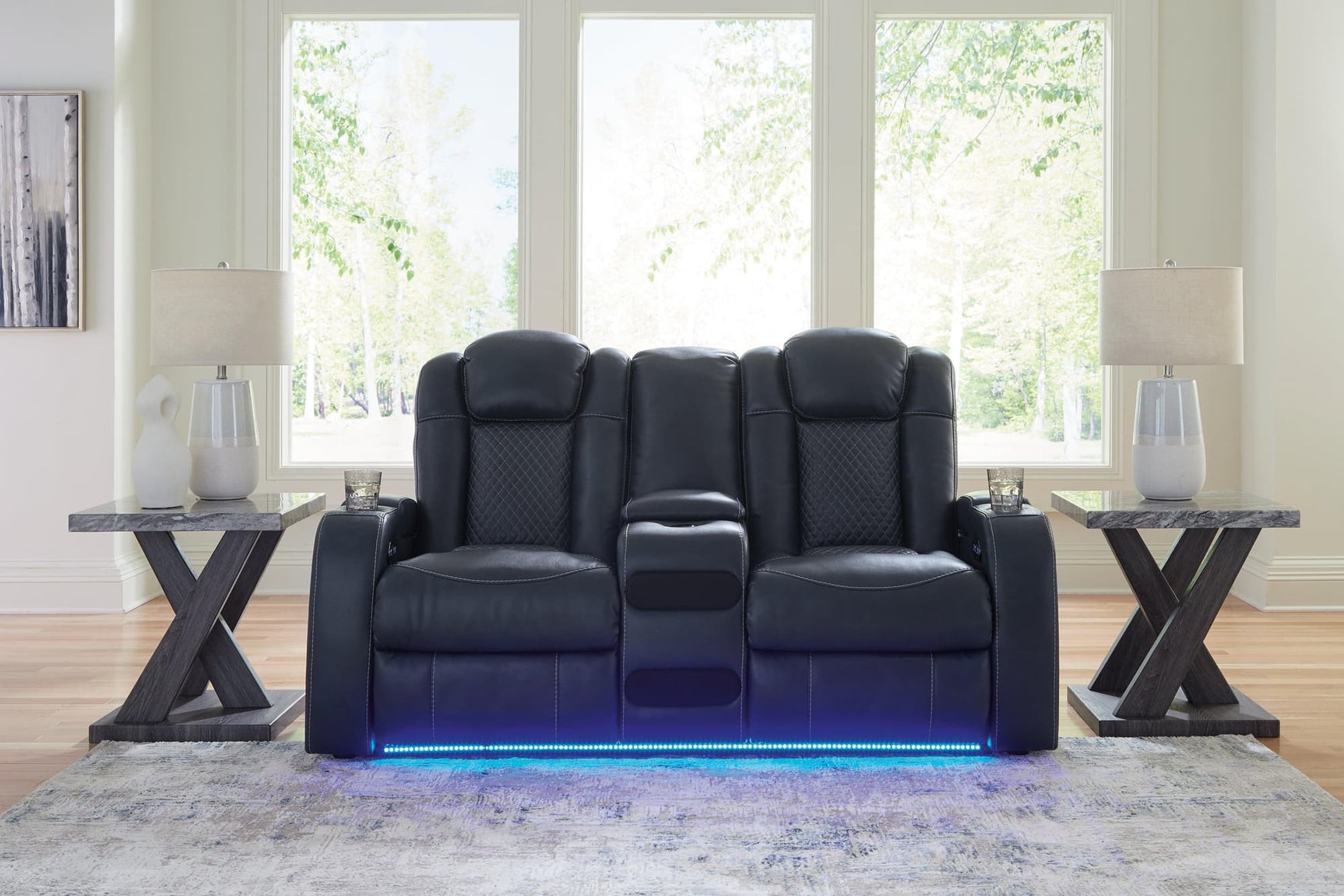 Fyne-Dyme Sapphire Faux Leather Power Reclining Loveseat with Console angled front view
