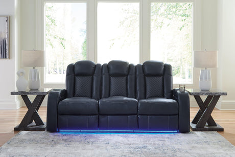 Fyne-Dyme sapphire faux leather power reclining sofa front angle with LED lighting and cup holders