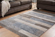 Sethburn Medium Rug front angle showing cream, brown, and gray stripes