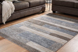 Sethburn Medium Rug front angle showing cream, brown, and gray stripes