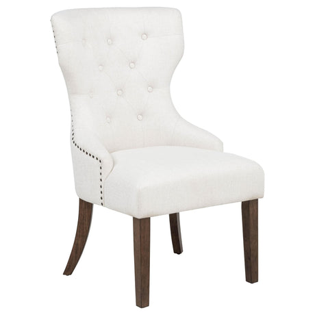 Baney dining side chair cream fabric with button-tufted wingback and dark oak legs