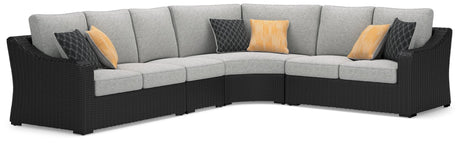 Beachcroft Black 4-Piece Outdoor Sectional angled view showing left-arm loveseat and corner chair
