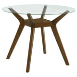 Paxton 48-inch round glass top dining table, front view showing wood legs
