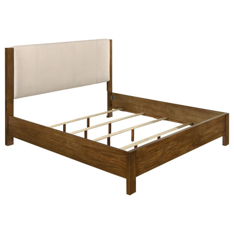 Adderley Eastern King Wood Panel Bed front view showing cream upholstered headboard and warm brown wood frame