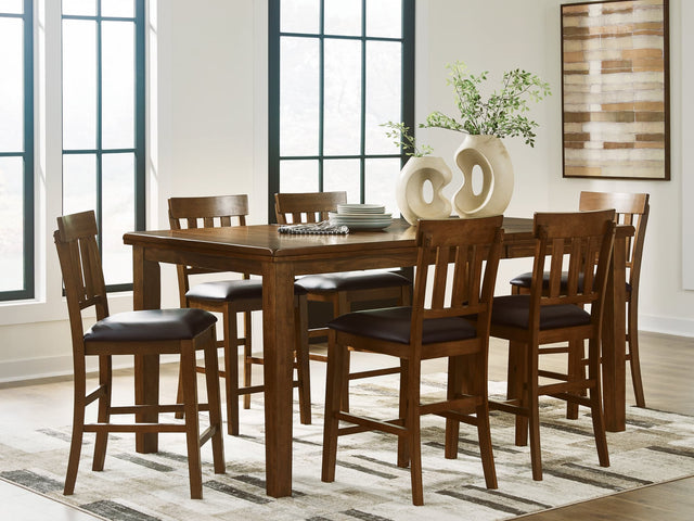 Ralene medium brown counter height dining table with six faux leather upholstered barstools