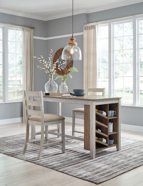 Skempton two-tone counter height dining table with two upholstered barstools front view
