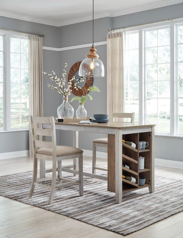 Skempton two-tone counter height dining table with two upholstered barstools front view
