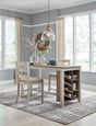 Skempton two-tone counter height dining table with two upholstered barstools front view