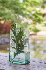 Small green ceramic vase with classic design, front view