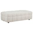 Amara upholstered ottoman side view showing fabric texture