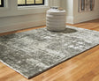 Valmontic Gray Medium Rug laid flat showing abstract gray and ivory design