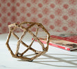 Laddington sculpture set with antique brass finish, front angle