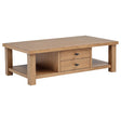 Beasley wood coffee table in golden oak with two drawers, front angle