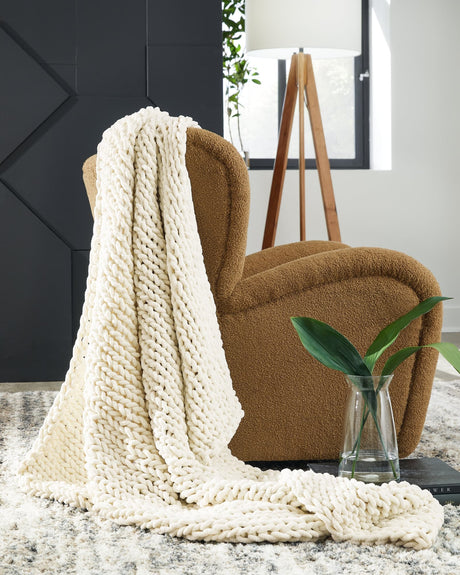 Chaddon Ivory Throw draped over armchair close-up