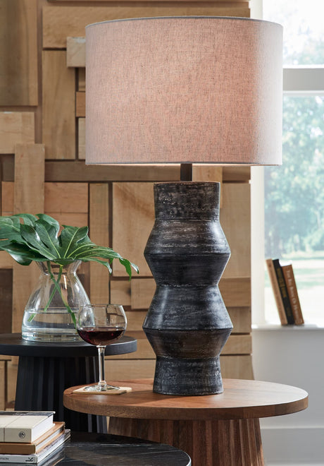 Kerbert table lamp front view showing distressed black terra cotta base and drum shade