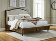 Sturlayne Brown Queen Upholstered Panel Bed front view with upholstered headboard